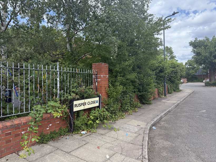 The locked entrance gate and notice board at Rainbow Park.